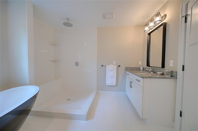 bathroom featuring a sink, visible vents, a freestanding bath, a shower, and double vanity