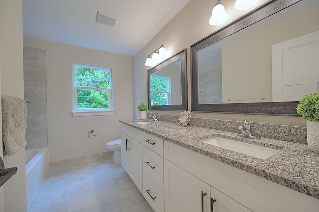 full bathroom with visible vents, a sink, toilet, and double vanity