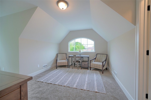 sitting room with carpet, visible vents, lofted ceiling, and baseboards