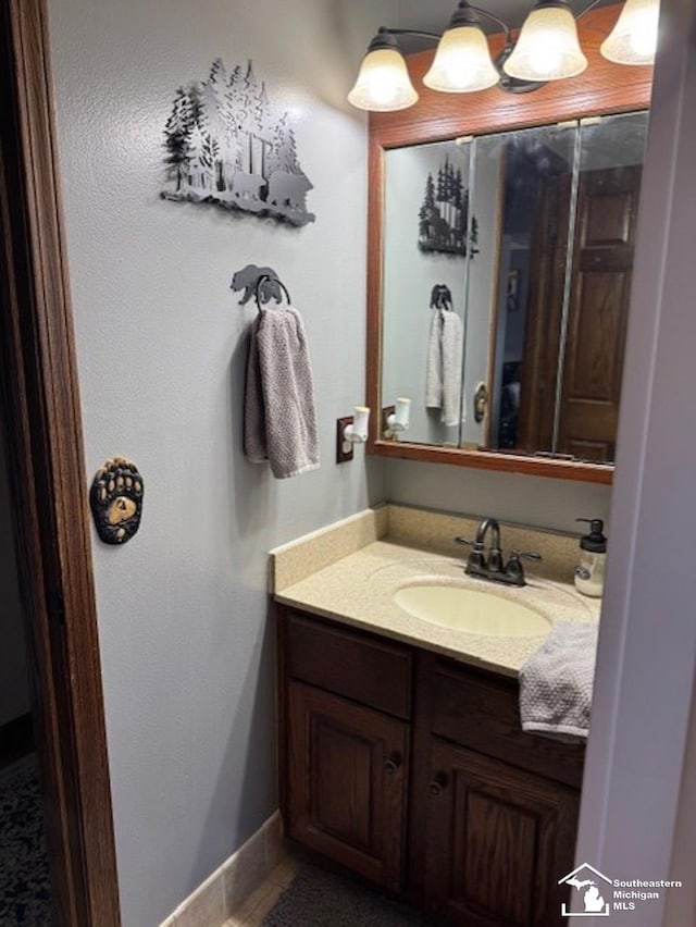 bathroom featuring vanity and baseboards