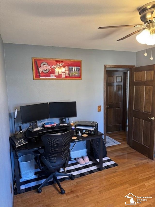 office space featuring ceiling fan and light wood finished floors