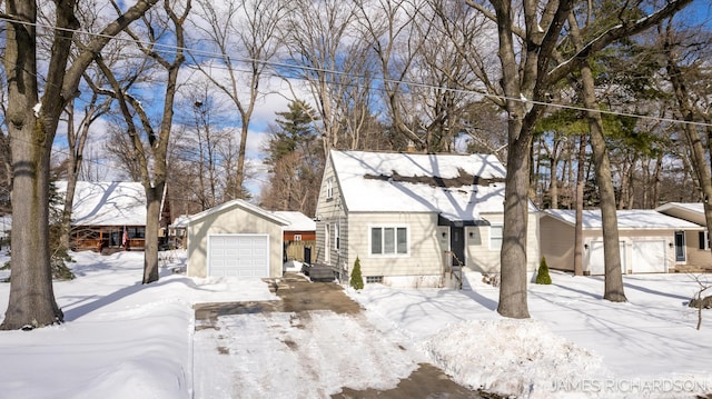 view of front of home with a garage, an outbuilding, and entry steps