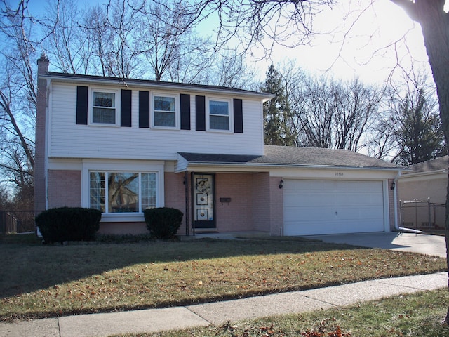 view of front facade with an attached garage, brick siding, concrete driveway, a front lawn, and a chimney