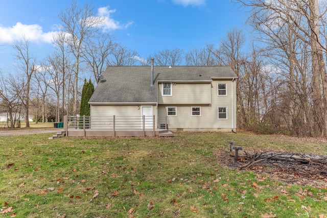 rear view of house with crawl space, a lawn, and a wooden deck