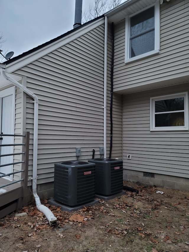 exterior space featuring crawl space and cooling unit