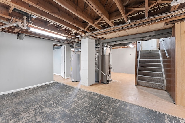 unfinished basement with gas water heater, heating unit, and stairs