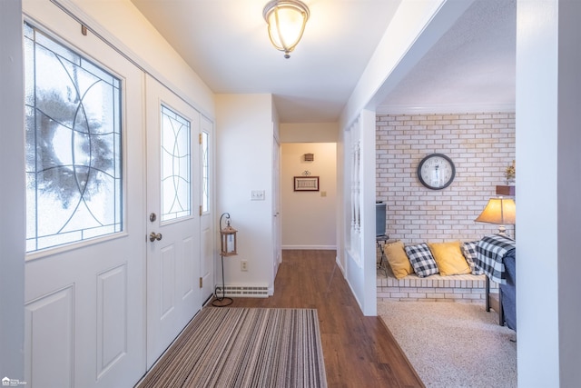 entryway featuring wood finished floors and baseboards