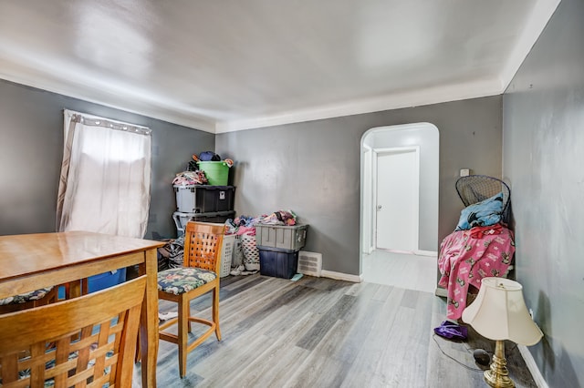 interior space featuring baseboards and wood finished floors