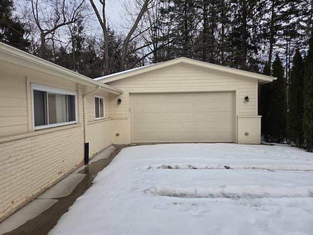 view of snow covered garage