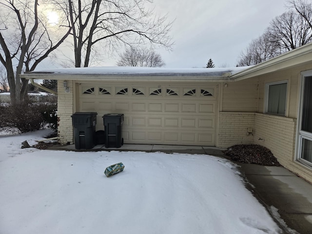 view of snow covered garage