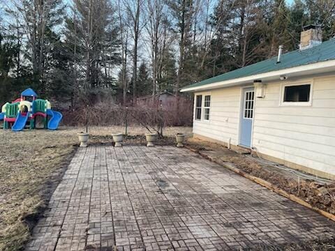 view of patio with a playground