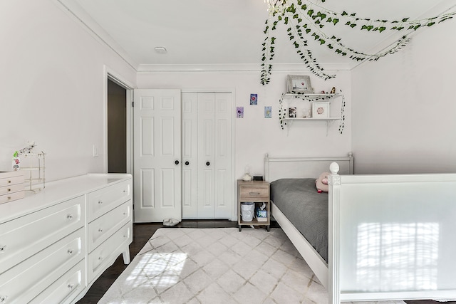 bedroom with a closet and ornamental molding