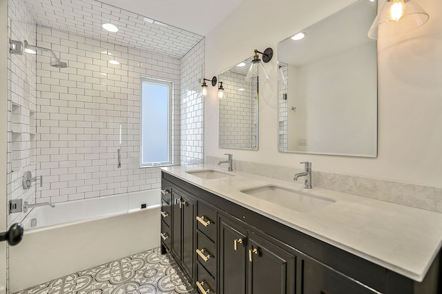 bathroom with a sink, double vanity,  shower combination, and tile patterned floors