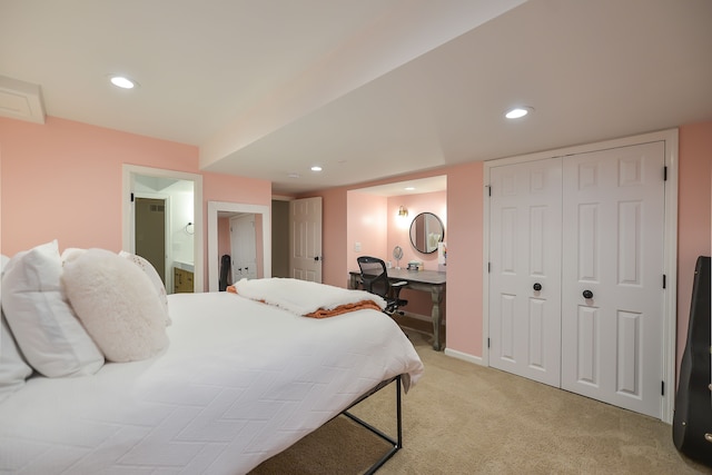 bedroom featuring recessed lighting, light colored carpet, baseboards, and connected bathroom