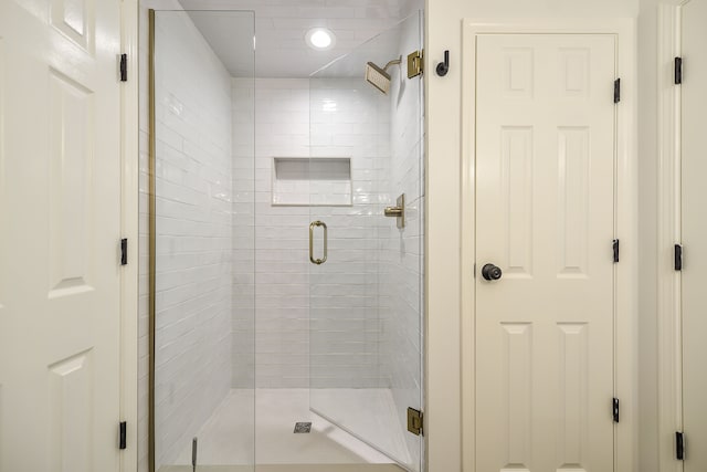 full bath with a shower stall