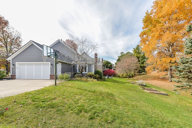 view of front of property with a garage, driveway, and a front yard