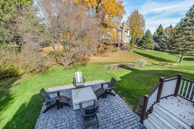 view of yard with stairs, a patio, and a wooden deck