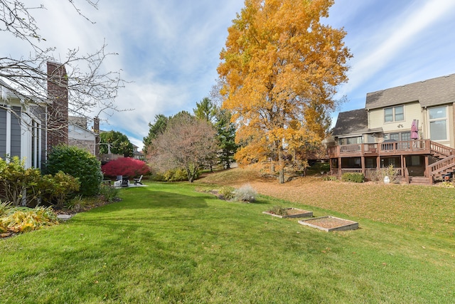 view of yard featuring stairway and a wooden deck