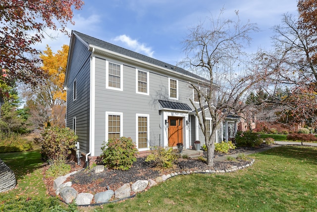 colonial home with a front yard