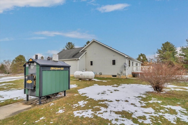 view of home's exterior with an outdoor structure