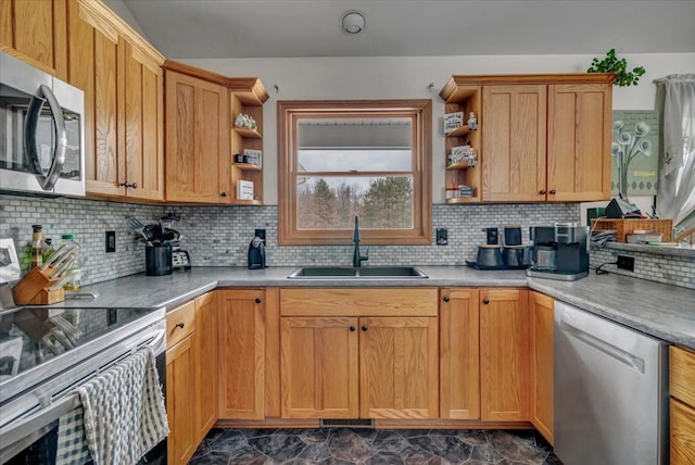 kitchen with tasteful backsplash, appliances with stainless steel finishes, open shelves, and a sink