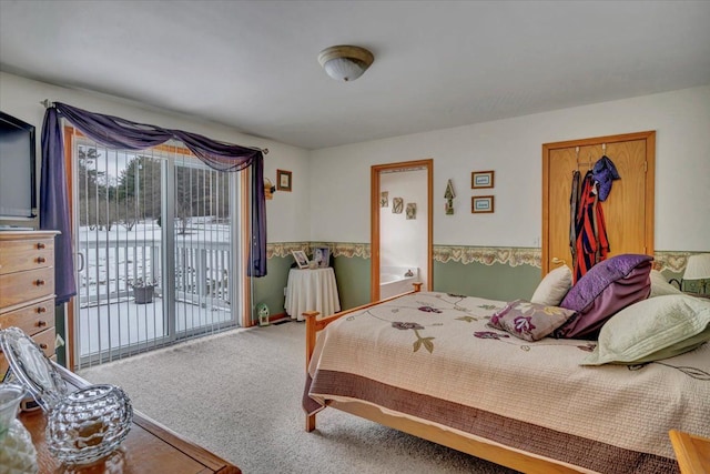 carpeted bedroom featuring access to outside