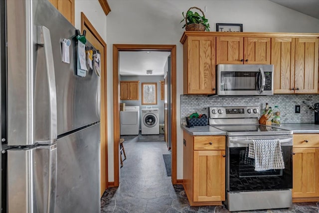 kitchen featuring independent washer and dryer, backsplash, appliances with stainless steel finishes, and light countertops