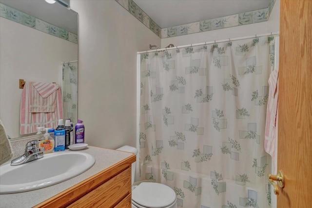 full bathroom featuring vanity and toilet