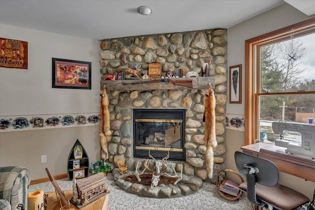 living area featuring a fireplace