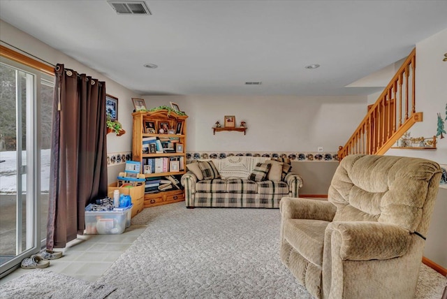 living room with recessed lighting, visible vents, and stairway