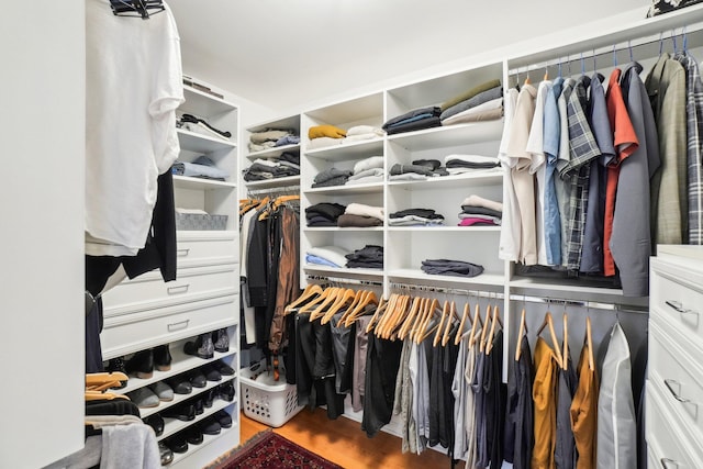 spacious closet featuring wood finished floors