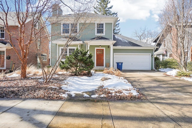 view of front facade featuring driveway, a chimney, and an attached garage