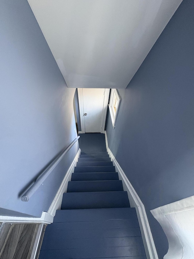 stairway with baseboards