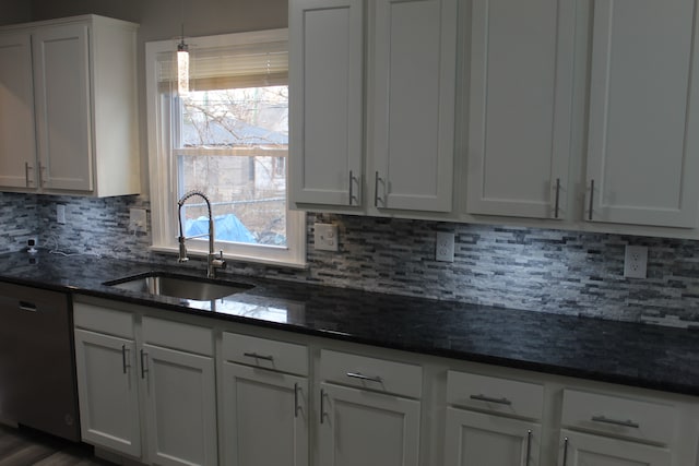 kitchen featuring dishwasher, a sink, white cabinetry, and a healthy amount of sunlight