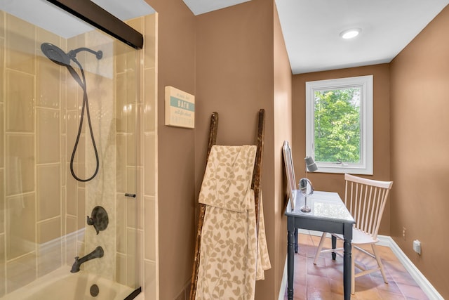 full bath with tile patterned flooring, baseboards, and bathing tub / shower combination