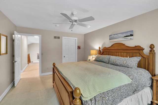 bedroom with baseboards, a ceiling fan, visible vents, and light colored carpet