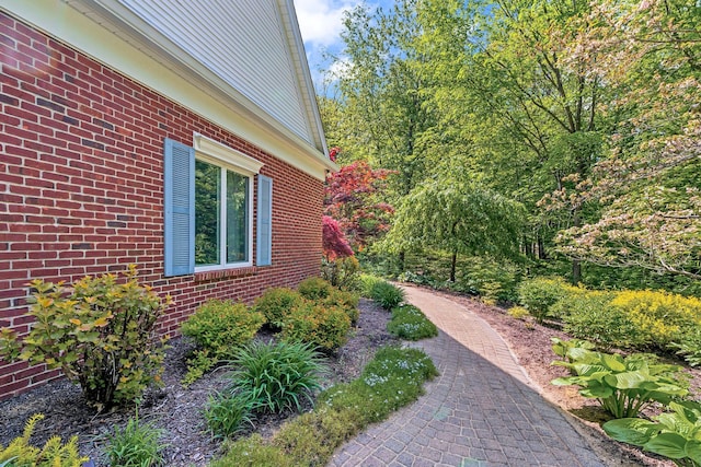 view of home's exterior with brick siding