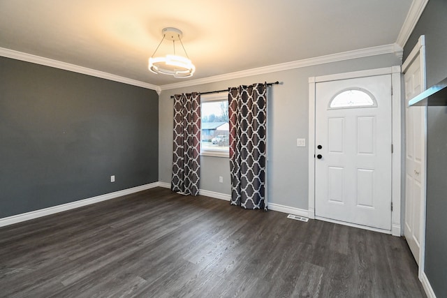 foyer entrance featuring visible vents, baseboards, dark wood-type flooring, and ornamental molding