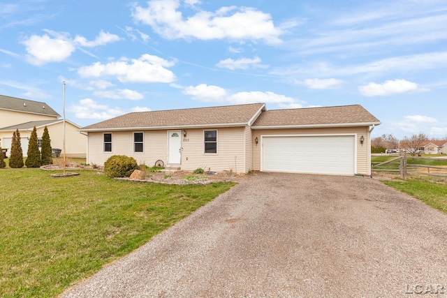 ranch-style home featuring driveway, fence, a front yard, a garage, and roof with shingles