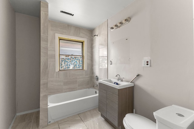 bathroom with shower / washtub combination, vanity, and toilet