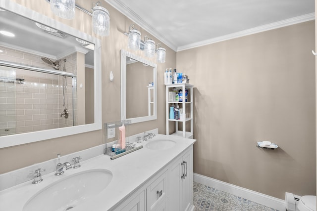 full bath featuring a tile shower, baseboards, a sink, and crown molding