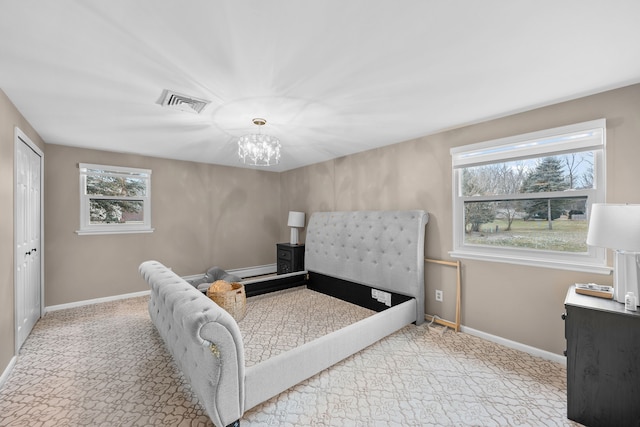 carpeted living room featuring visible vents, baseboards, a chandelier, and a wealth of natural light