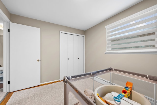 bedroom with a closet and wood finished floors