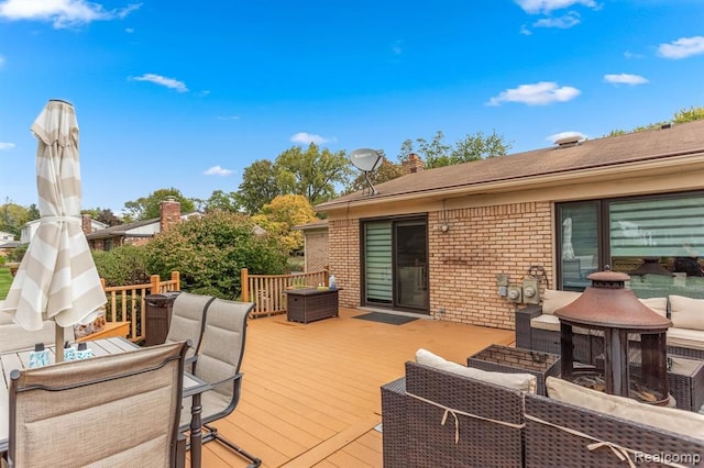 wooden terrace featuring outdoor dining space