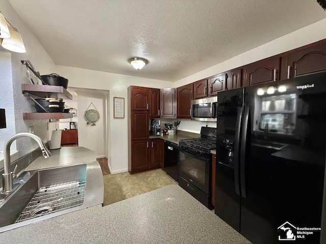 kitchen with a sink, dark brown cabinets, a textured ceiling, and black appliances