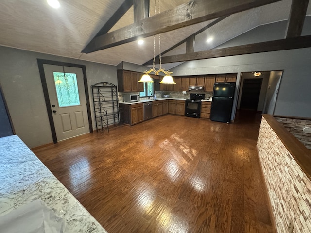 19084 200th Ave, Tustin, MI 49688 - kitchen featuring black appliances, light countertops, dark wood finished floors, under cabinet range hood, and decorative light fixtures