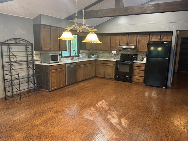 19084 200th Ave, Tustin, MI 49688 - kitchen featuring black appliances, under cabinet range hood, dark wood finished floors, light countertops, and a textured wall