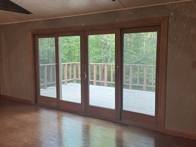19084 200th Ave, Tustin, MI 49688 - doorway with baseboards and wood finished floors