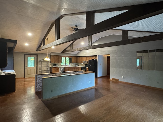 19084 200th Ave, Tustin, MI 49688 - kitchen featuring black appliances, a ceiling fan, dark wood-type flooring, brown cabinets, and a center island