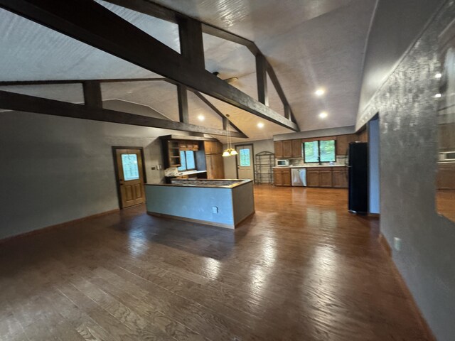 19084 200th Ave, Tustin, MI 49688 - unfurnished living room featuring dark wood finished floors and recessed lighting